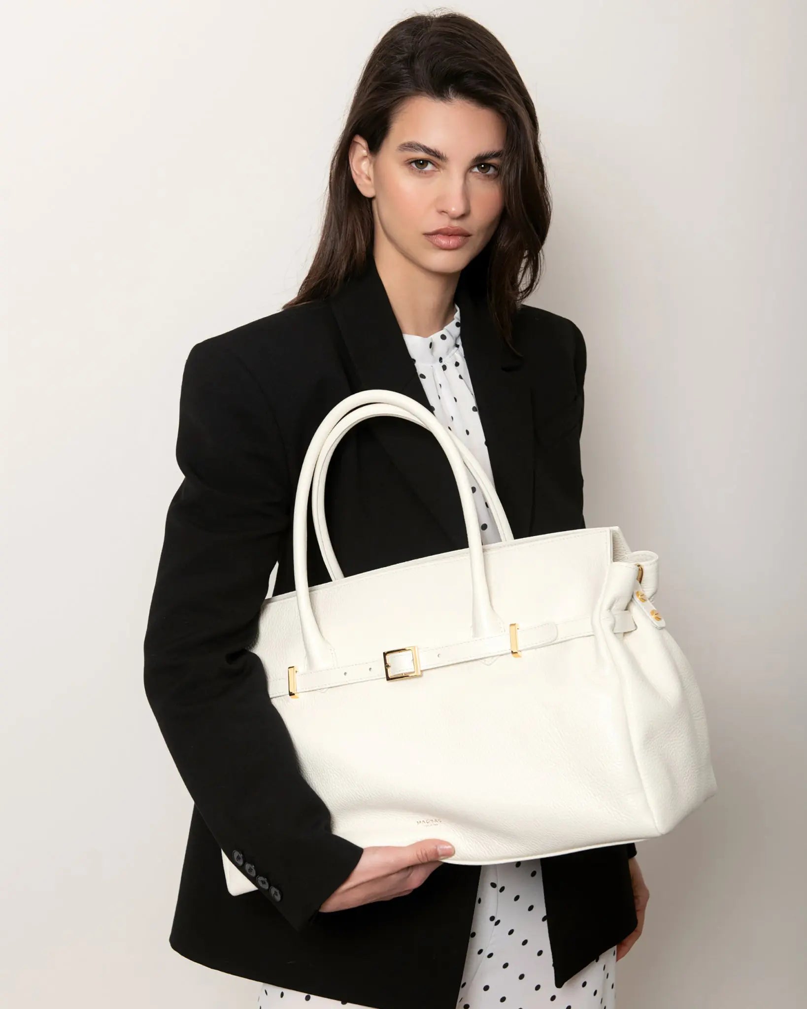 Close-up of BELLUCCI tote bag in Cloud Dancer leather with gold buckle detail, Italian handcrafted luxury bag