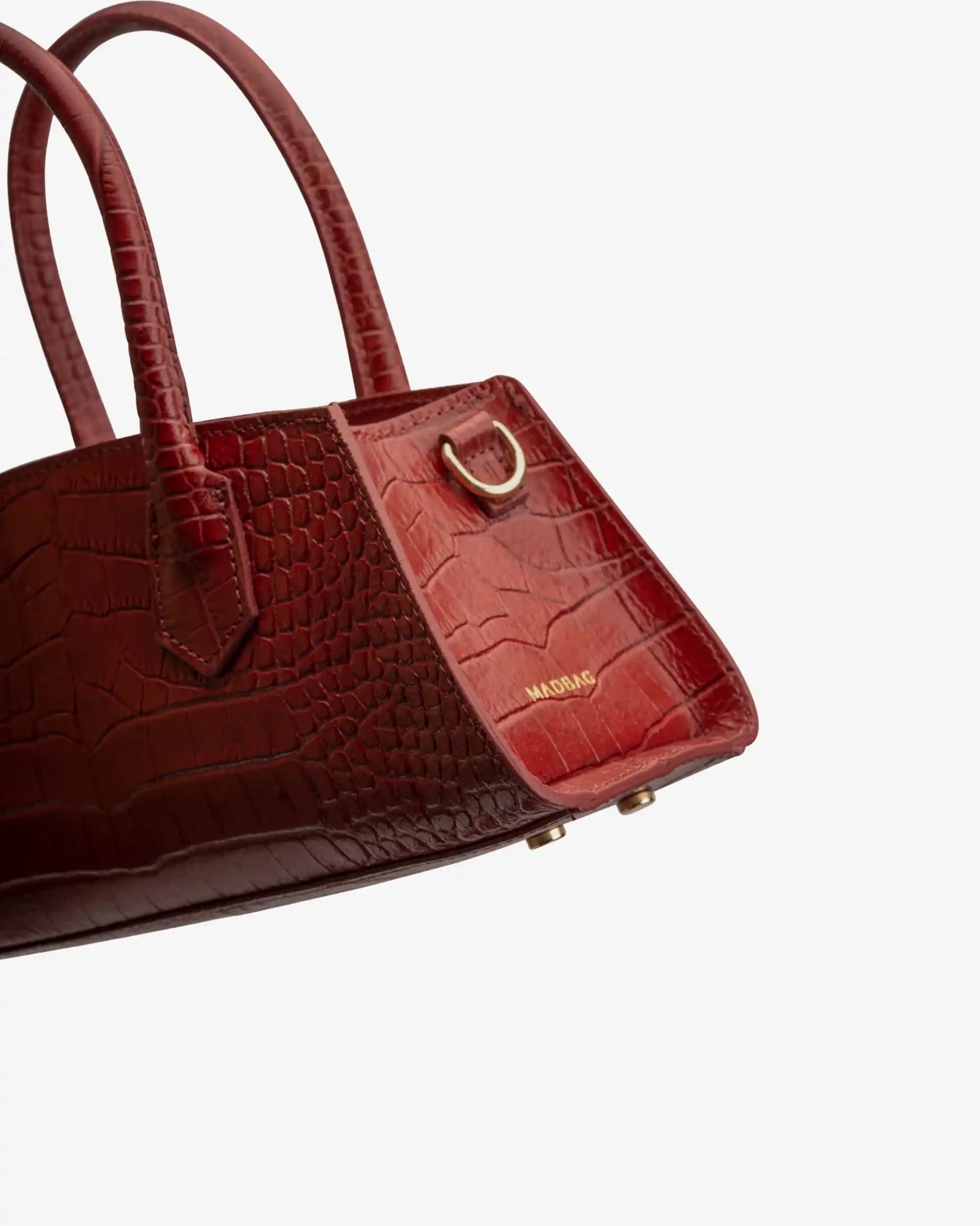 Dettaglio laterale borsa Small Bassotto Croc rossa con finitura effetto coccodrillo