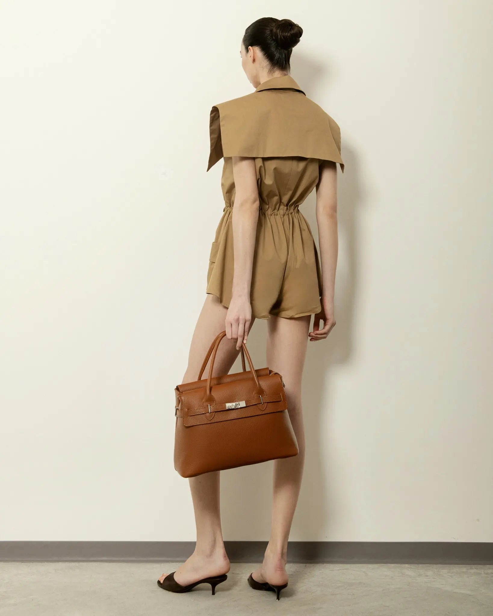 MADBAG Bowling handbag in brown dollaro leather worn by model back view